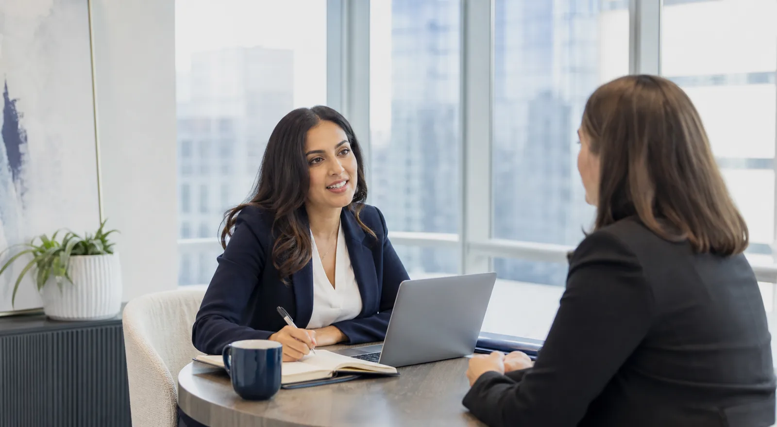 Recruitment consultant having a focused client conversation